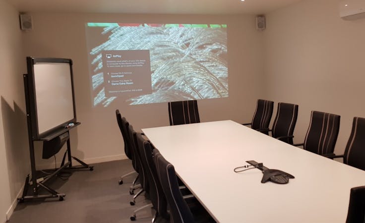12-person boardroom space, perfect for formal presentations, image 1